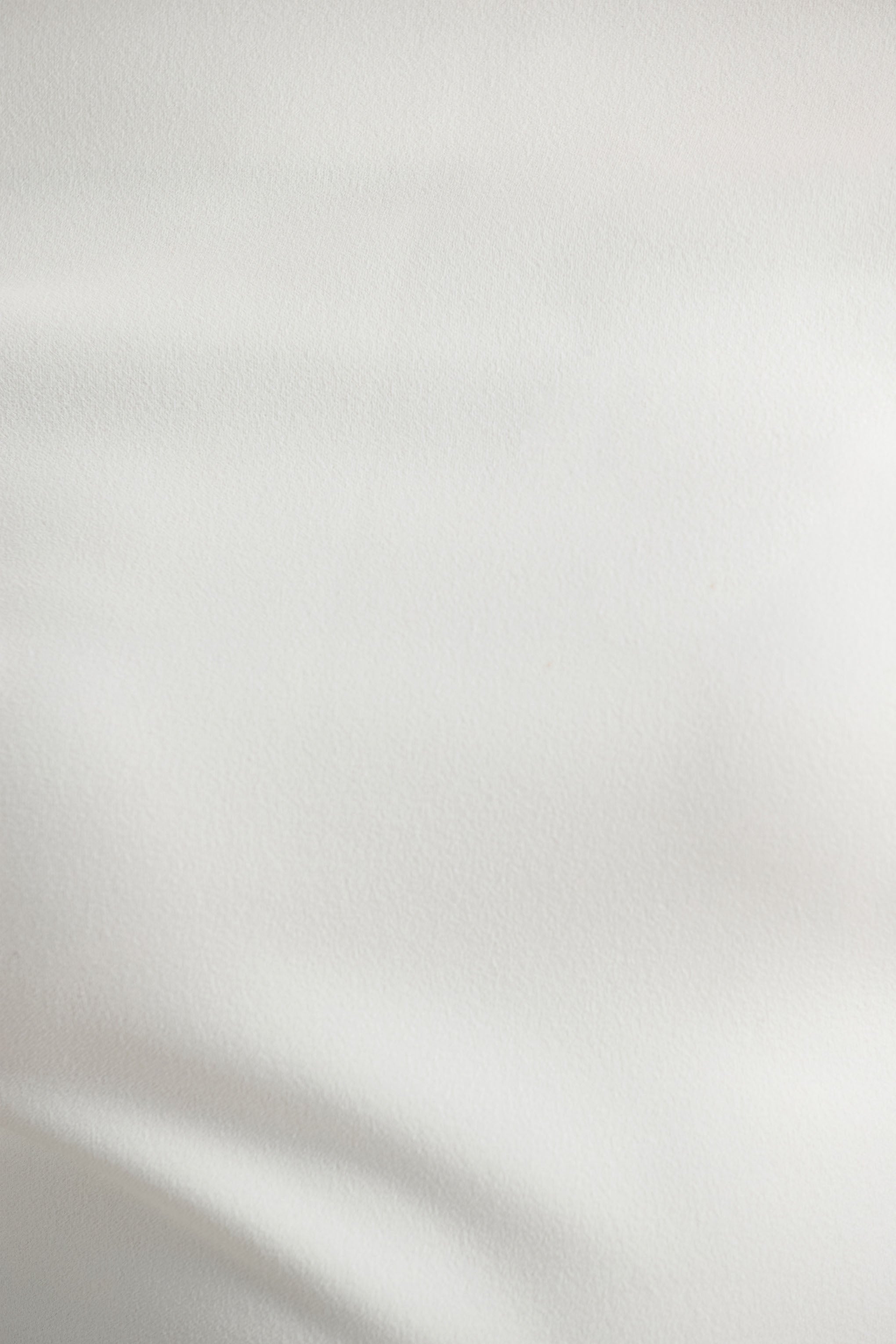 Alexandra | Weißer asymmetrisch drapierter Jumpsuit